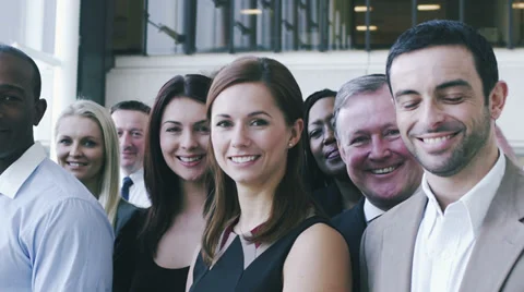 Portrait of a large business team. Content young business team smiling into Stock Footage