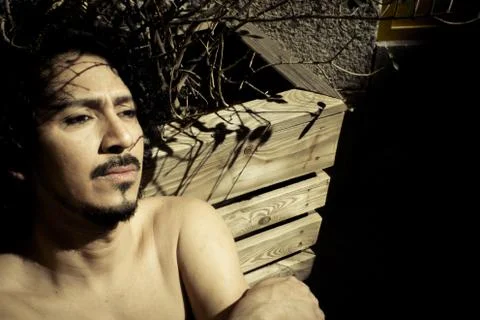 Portrait of latin man with beard and curly black hair Stock-Fotos