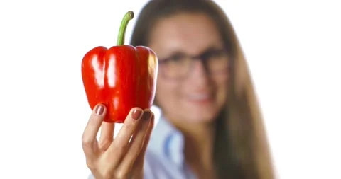 Portrait of latin woman with red bell pepper isolate on white background.  Stock Footage 131676853