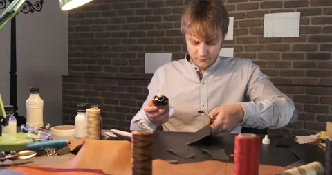 Portrait of Leatherworker, Making Small Leather Items, Clothing and Shoes Stock Footage 133008907