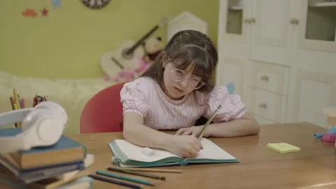 Portrait of a little boy doing school homework. Stock Footage 203830210