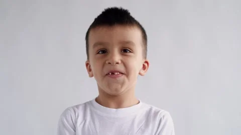 Portrait Little boy Looking at Camera, Young Laughs Happily Child with Glasses Video stock 174356600