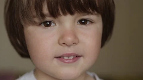 Portrait Little Boy Looking at Camera. Young Laughs Happily Child with Glasses Stock Footage 243816529