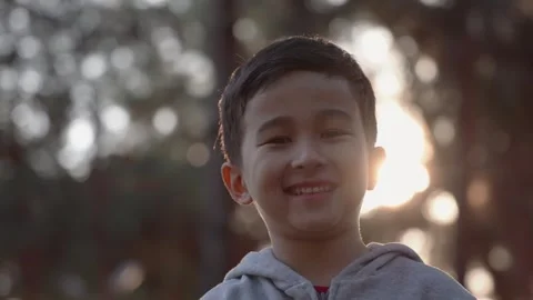 Portrait little boy looking at camera. Young laughs happily. Stock Footage 244828566