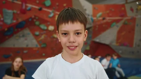 Portrait of a little boy looking at the camera and smiling Stock Footage 275329795