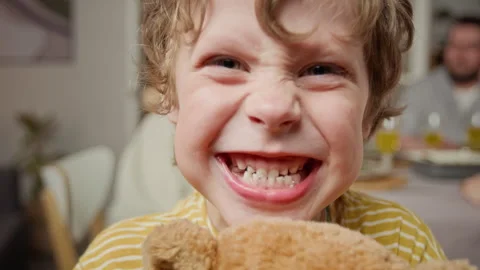 Portrait of Little Boy Making Funny Angry Face and Showing Teeth Stock Footage 340339099