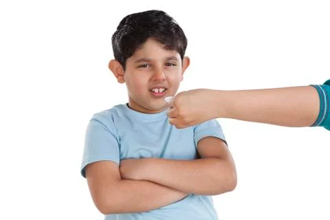 Portrait of little boy refusing to have medicine Stock Photos