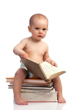 Portrait of a little boy sitting on a stack of books Stock-Fotos