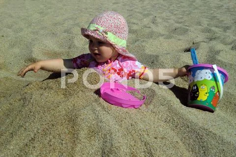 Portrait of little cute blond girl on the beach Stock Photos