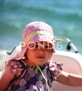 Portrait of little cute blond girl on the beach Stock Photos