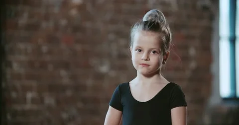 Portrait of a little girl ballerina 5-6 years in dance class Stock Footage