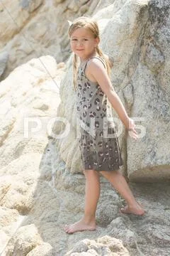 Portrait of Little girl on the sandy beach. Summer vacation. Stock Photos