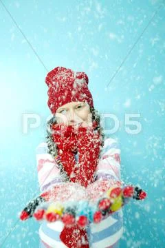 Portrait of little girl in warm clothing in snow Stock Photos