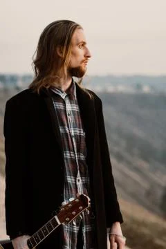Portrait of long haired bearded guy in the susnet Foto stock