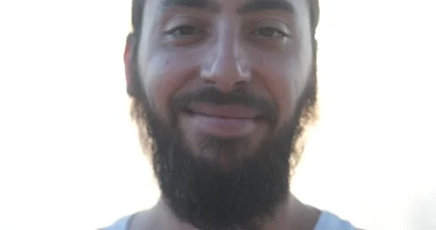 Portrait of long haired, bearded hipster student guy. Smiling man on seaside, Stock Footage 156298718
