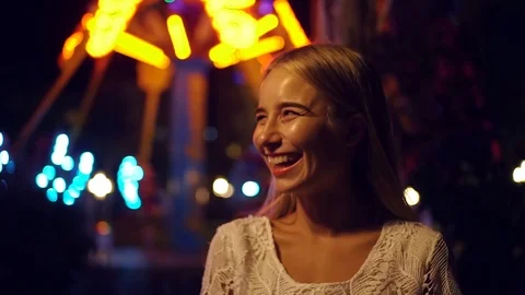 Portrait long-haired blonde young caucsian girl happily smiles look to camera Stock Footage 99672347