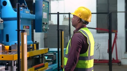 Portrait Of A Machine Operator Creating A Program During Production Process In Stock Footage 333194199