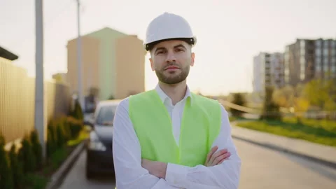 Portrait of a male builder engineer worker standing in a renovated house, posing Stock Footage 244904061