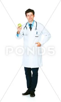Portrait of a male doctor holding green apple on white Stock Photos