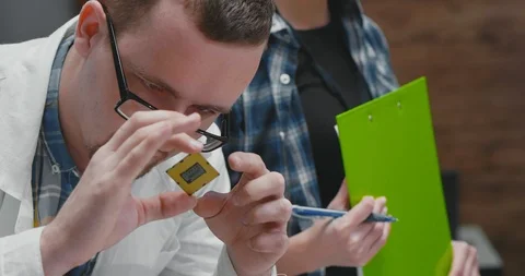 Portrait of male engineer examining computer processor 库存影片 97490076