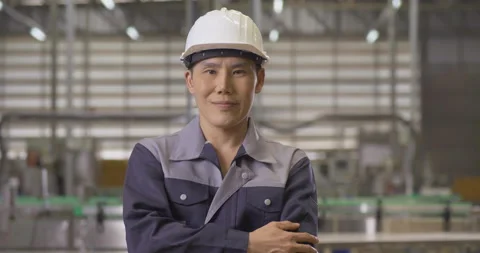 Portrait of male engineer looking to camera and smile at modern factory. Stock-Footage 168075366