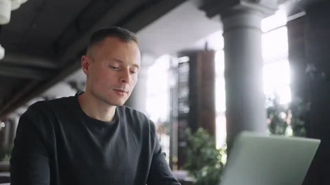 Portrait Of Male Freelancer Using Laptop In Cafe, Man With Portable Computer Stock Footage 247412696