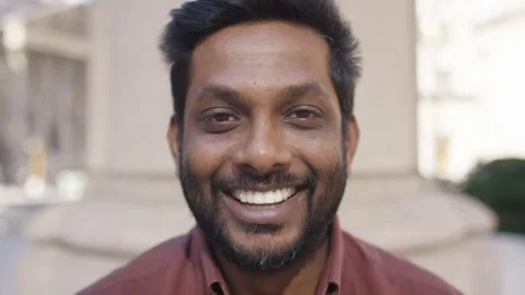 Portrait of male looking to camera before smiling, in slow motion  Stock Footage 249710359
