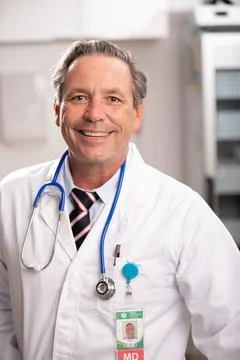 Portrait of Male Medical Doctor with White Lab Coat in Hospital or Clinic Stock Photos