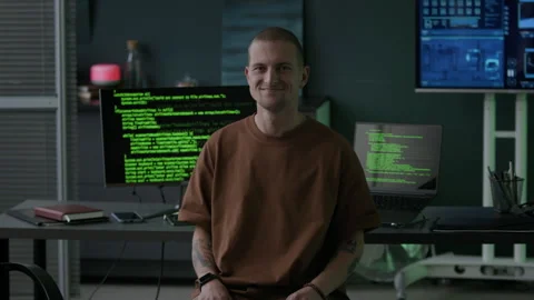 Portrait of Male Programmer in Office with Running Program Codes on Screens Stock Footage 292622834
