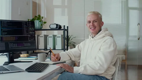 Portrait of Male Programmer Posing in front of Coding Screen Stock Footage 303558156