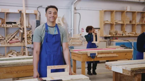 Male Student Studying For Carpentry Apprenticeship At College