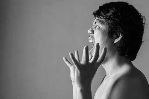 Portrait of man afraid of something on white Stock-Fotos