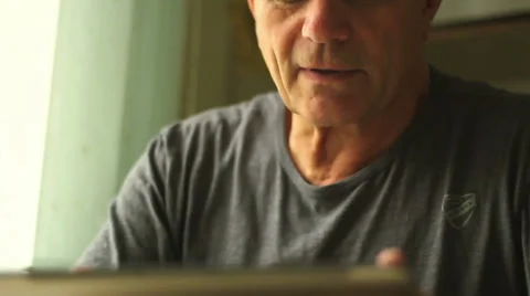 Portrait of a man at the age with Tablet PC Stock Footage 29678076