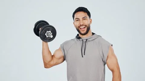 Portrait, man and bodybuilder in studio with dumbbell, workout or strength Stock Photos