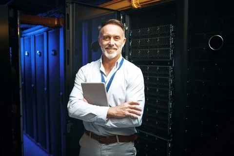 Portrait, man and programmer with tablet in server room for research, codin.. Stock-Fotos