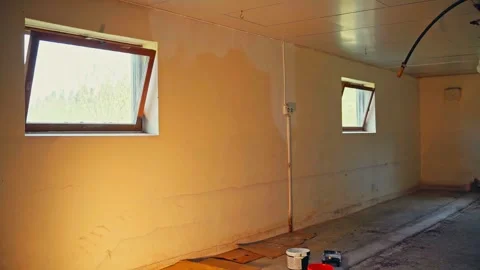 Portrait Of A Man Applying Primer First Coat During Renovation. Timelapse Stock Footage 314379480