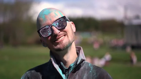 Portrait Man with beard and mustache in powder colors celebrating Holi Stock Footage 257207532