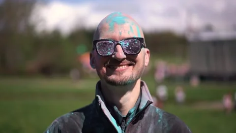 Portrait Man with beard and mustache in powder colors celebrating Holi Stock Footage 257207561