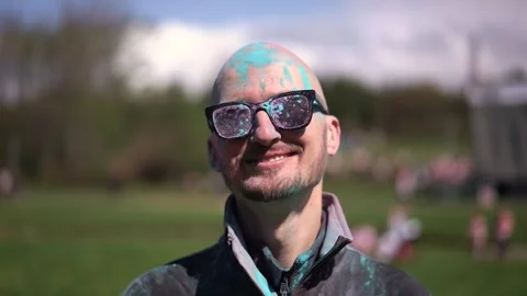 Portrait Man with beard and mustache in powder colors celebrating Holi Stock Footage 257207587