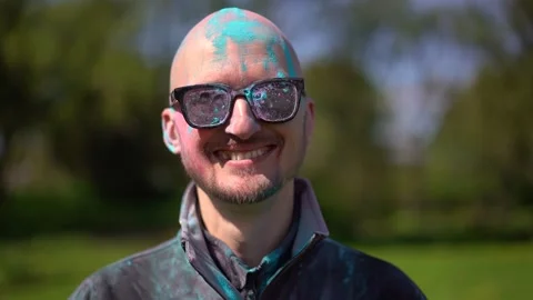Portrait Man with beard and mustache in powder colors celebrating Holi Stock Footage 257207741