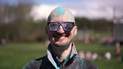 Portrait Man with beard and mustache in powder colors celebrating Holi Stock Footage 257207853