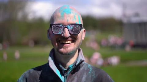 Portrait Man with beard and mustache in powder colors celebrating Holi Stock Footage 257207940