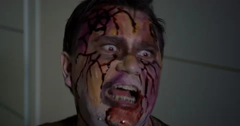 Portrait of man with braces on teeth who has just turned into a zombie. Undead Stock Footage 200060694