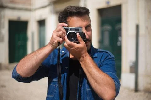 Portrait of man with camera Stock Photos