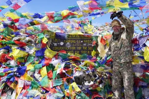 Portrait of man in camouflage in background Thorong-La pass Stock Photos