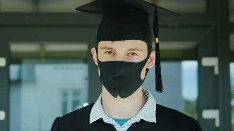 Portrait of a man in a cap and robe and a protective mask on his face Stock Footage 132867324