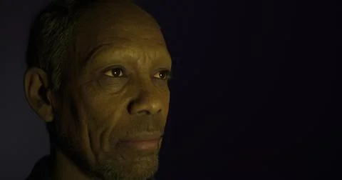 Portrait of a man with contemplative expression and subtle lighting effects Illustrazione stock