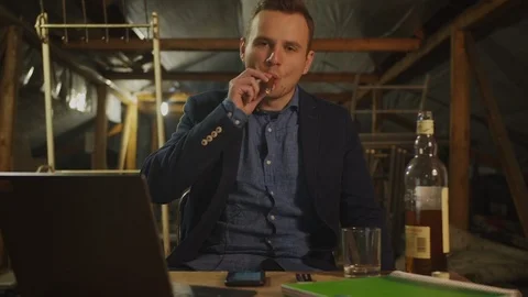 Portrait of man in dark blue jacket drinking whiskey, smoking cigar with smoke,  Stock Footage 119033525
