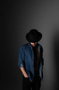 Portrait of a man in a dark key in the studio Stock Photos