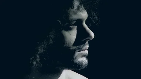 Portrait of man in darkness desaturated profile feeling sadness Stock Footage 59491416